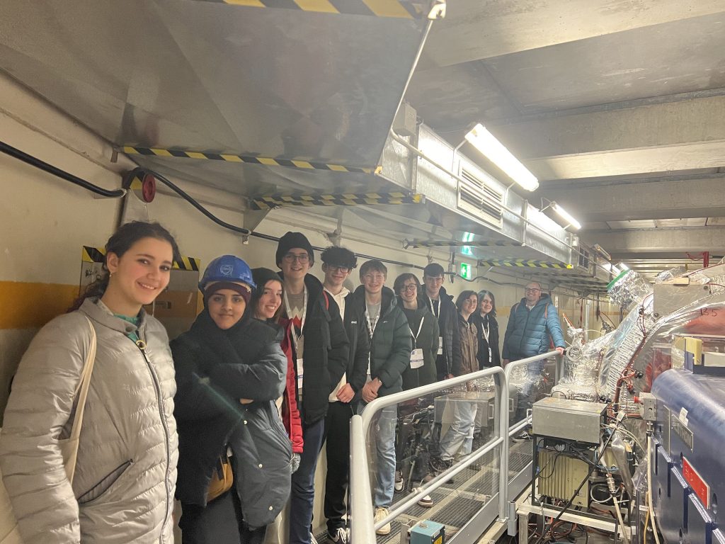smiling students standing on the viewing platform at CERN