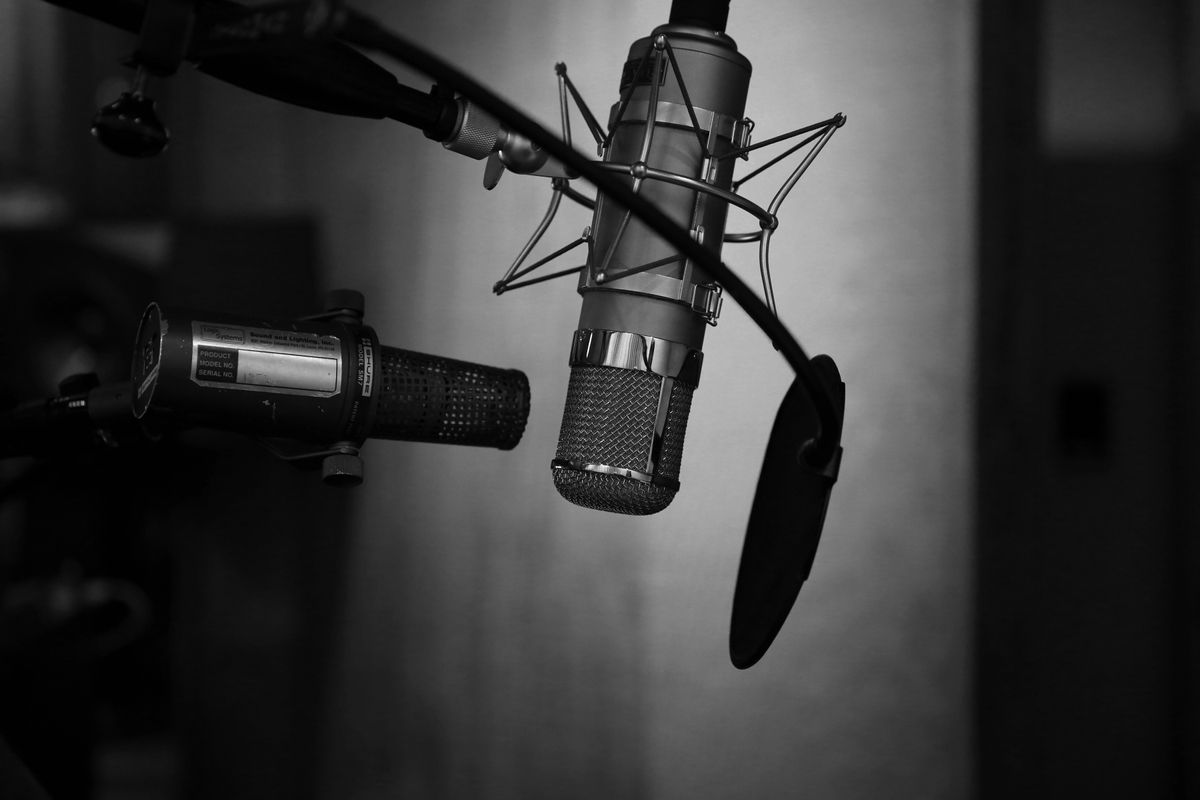 Black and white image of a microphone set up.