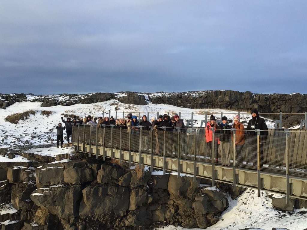 Loreto students standing on the Tectonic plates bridge in Iceland.