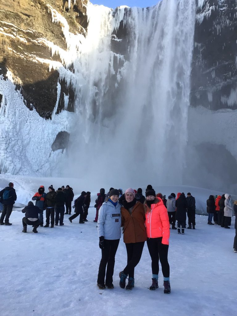 Loreto students pictured with a dramatic waterfall during a trip to Iceland