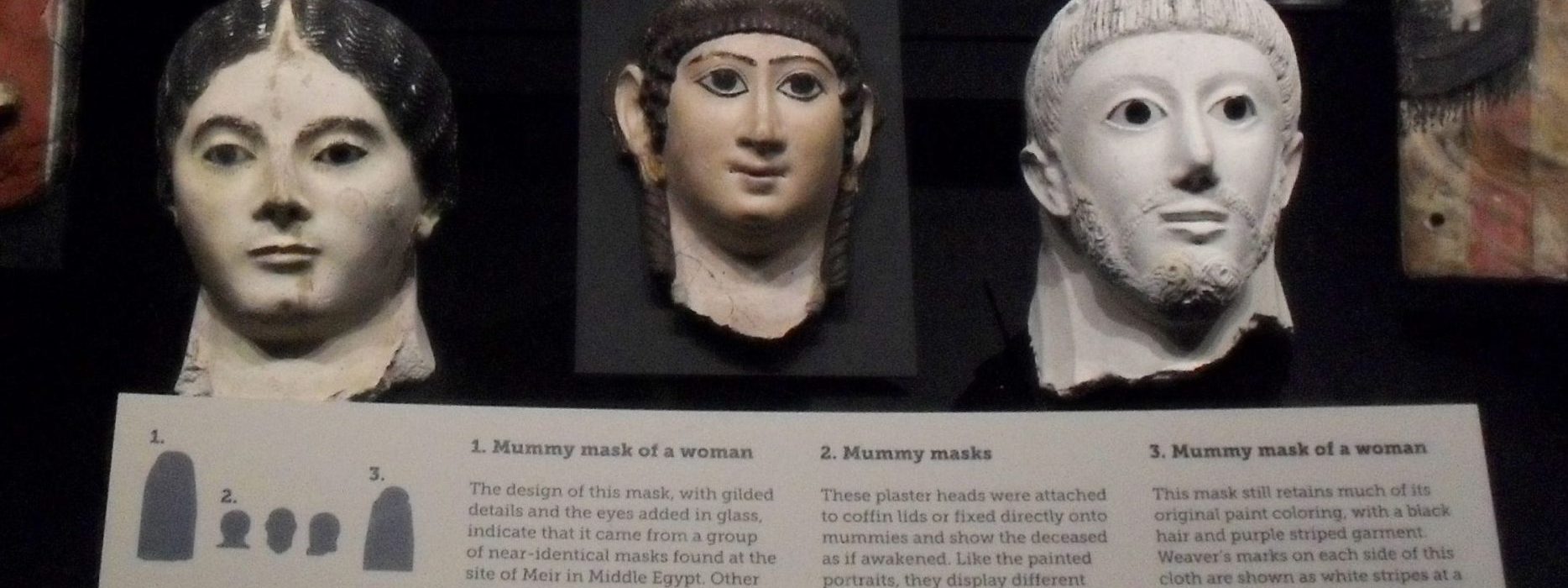 Various mummy masks exhibited at the Manchester Museum