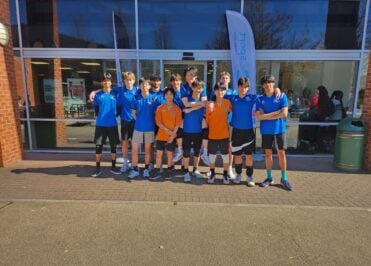 Loreto's male volleyball team photo taken outside the University of Nottingham.