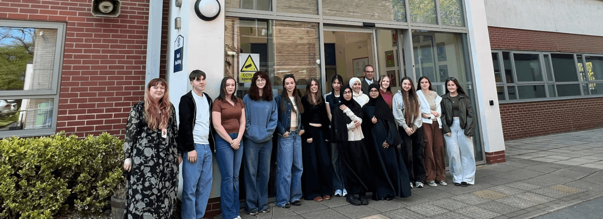 Aspire to Teach Class of 2026 students standing outside the main entrance of Loreto College, with the Principal positioned behind the group and the Aspire to Teach coordinator on the far left.