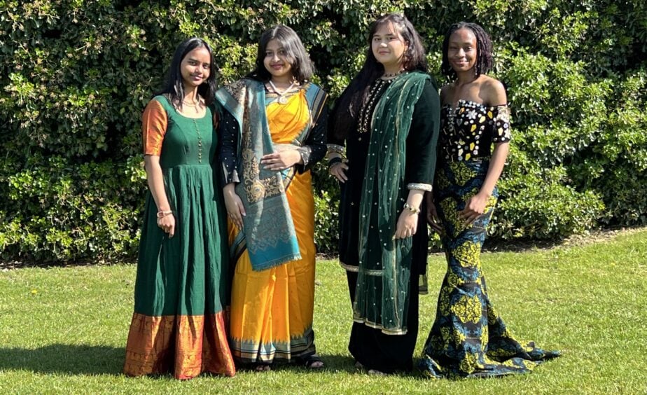 Group of students in colourful traditional dress at Loreto College Manchester Cultural Appreciation Day standing outdoors