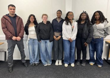 Upper Sixth Student Council members from Loreto standing together during a thank you event for their contribution to student leadership.