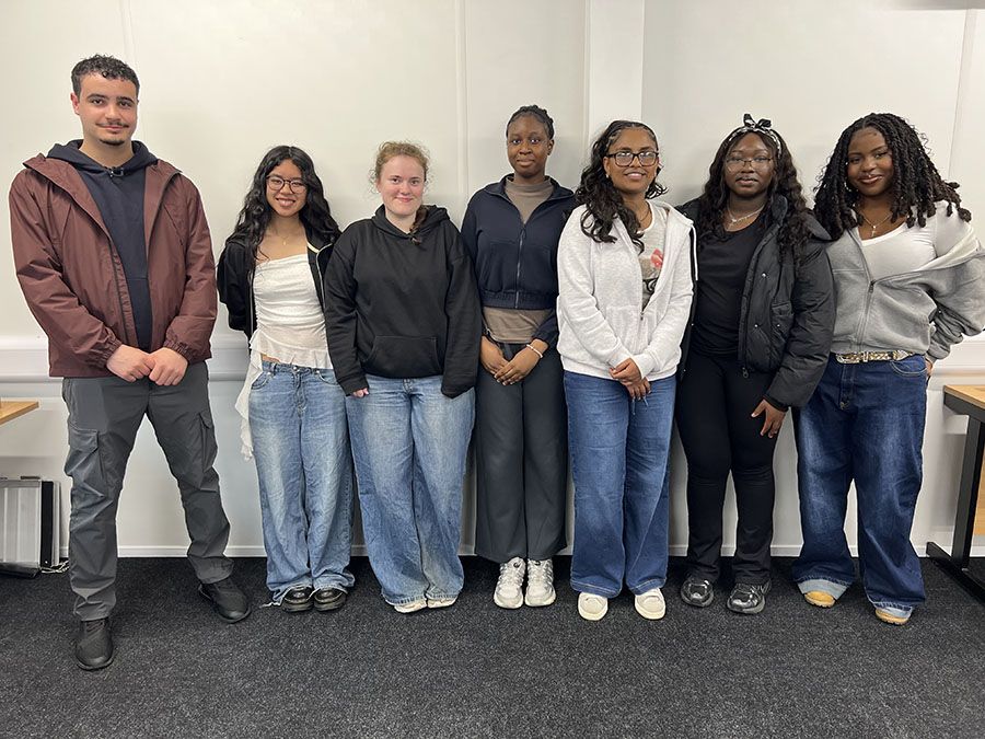 Upper Sixth Student Council members from Loreto standing together during a thank you event for their contribution to student leadership.
