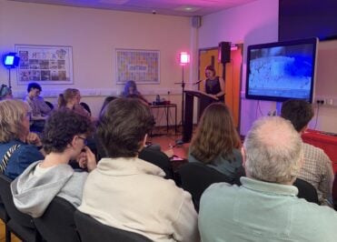 Audience members watch a presentation and film screening during the Loreto Film Awards 2026 ceremony at Loreto College.